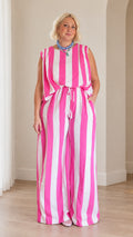 Front full view of woman wearing pink and white striped sleeveless top and matching wide leg pants set
