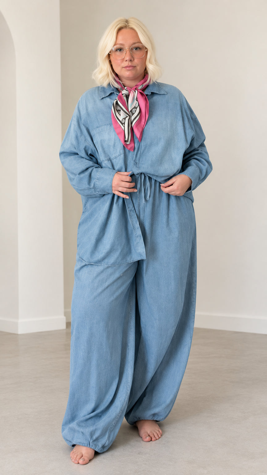 Front full-length view of model wearing the Light Blue relaxed button-down shirt and wide-leg matching pants set