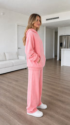 Side profile of pink hoodie and wide-leg sweatpants loungewear set