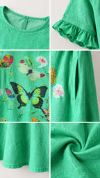 Close-up details of neckline, ruffled cuff, butterfly print, side pocket, and textured fabric
