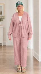Woman wearing dusty rose 2-piece tie-front knit cardigan and pants set