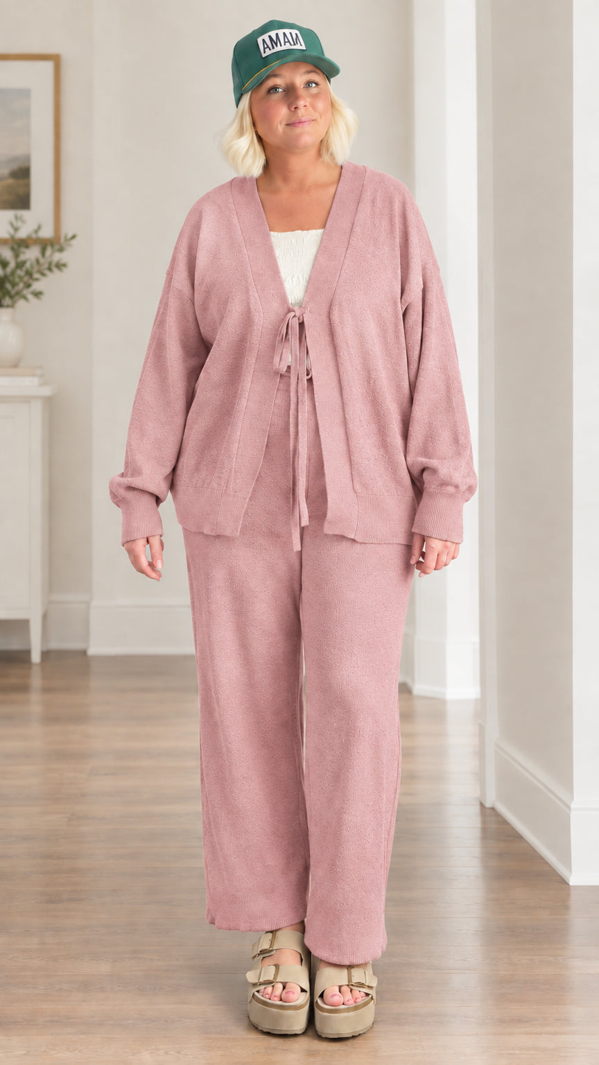 Woman wearing dusty rose 2-piece tie-front knit cardigan and pants set