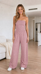 Front view of model wearing the dusty rose striped strapless wide-leg jumpsuit