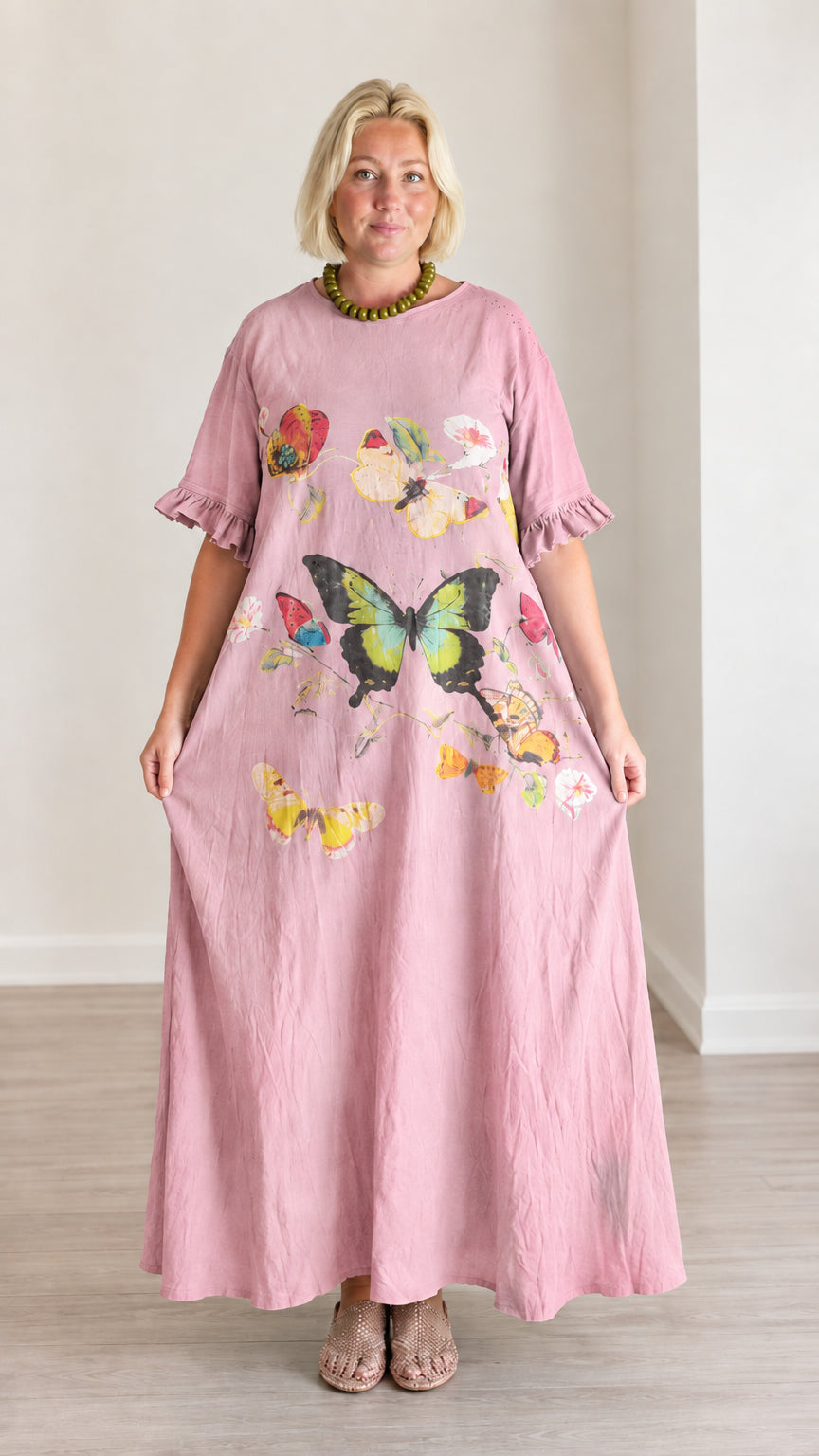 Front view of dusty pink maxi dress featuring colorful butterfly graphic print