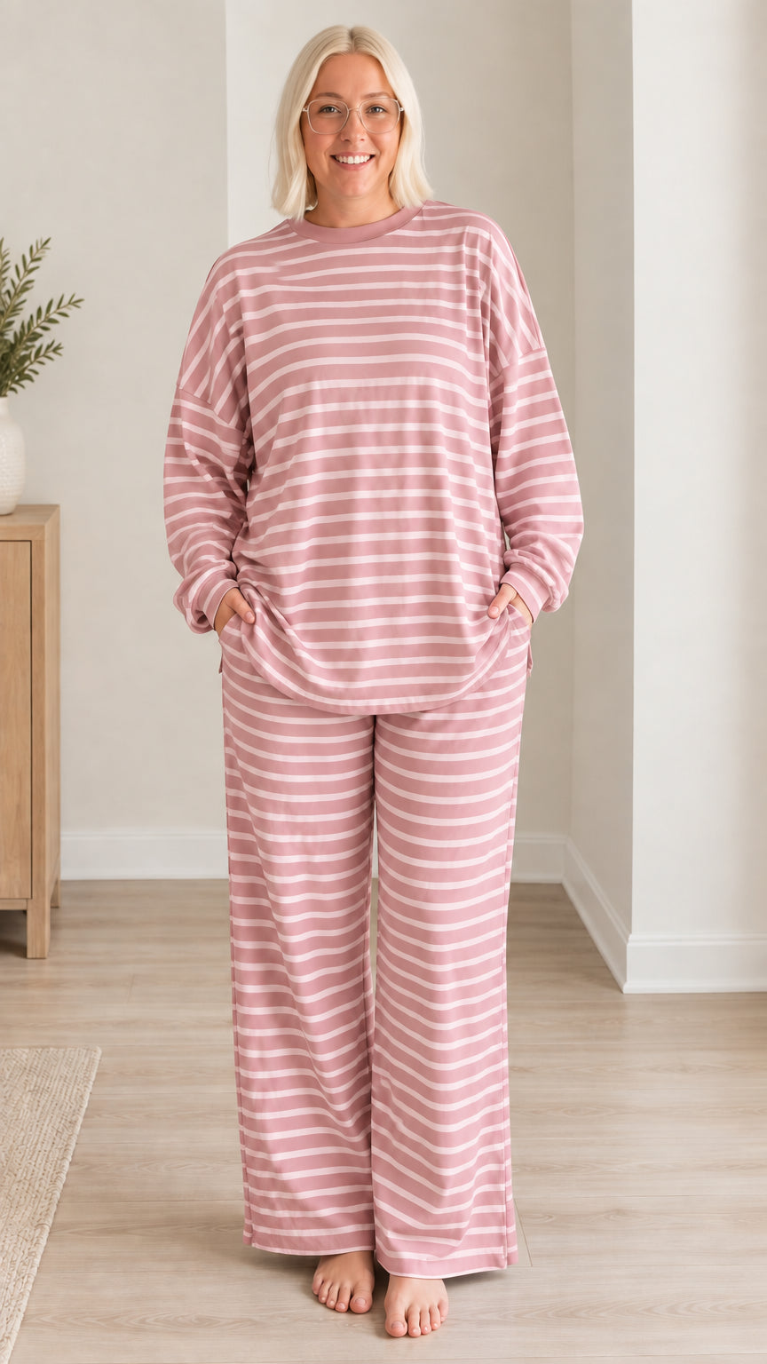 Front view of woman wearing dusty pink striped long sleeve lounge set