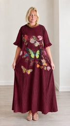 Front view of burgundy wine red butterfly print ruffle sleeve maxi dress
