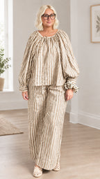 Full front view of model wearing beige and khaki striped two-piece pant set